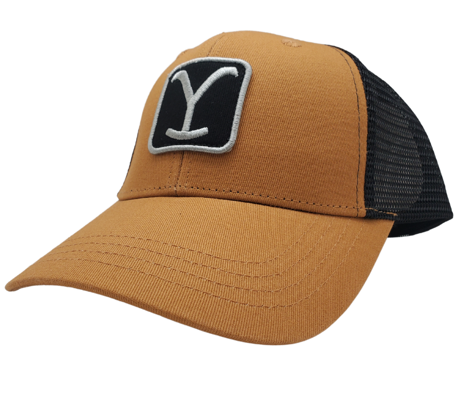 Explore the vast American wilderness and join John Dutton on his mission to save the Yellowstone Ranch and reunite his family. This cap features the Yellowstone logo on a Tan front and Black mesh back. Shop now at our Smyrna, TN location or online. Get ready for an unforgettable adventure!