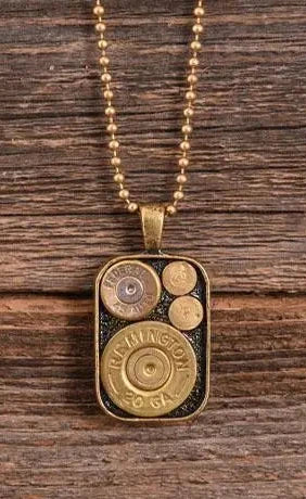 A Show your love for slingin' lead with these Shell casings Dog Tag necklaces. Accent any outfit with these Genuine Once Fired Rounds &amp; Genuine Swarovski Crystals. See them at our local Smyrna, TN shop not far from Murfreesboro. Made in USA.