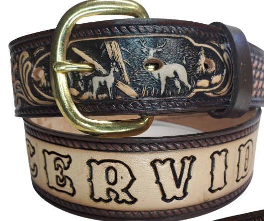 The Stag, Doe, Fawn leather belt is a classic Outdoors Pattern with DEER Family or the "Cervid".   Perfect the Outdoors lover in your family. Available in a 1 1/2" width. Full grain vegetable tanned cowhide, Width 1 1/2" and includes Nickle plated  buckle Smooth burnished painted edges. Made in USA! For name Type name desired on belt in "Type Name Here" section, no more than 9 LETTERS maximum on this PARTICULAR belt. Buckle snaps in place for easy changing if desired. In stock at our Smyrna, TN shop.