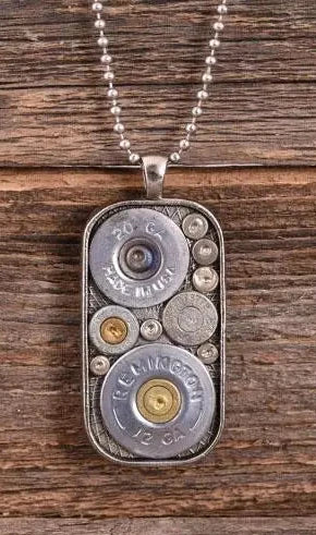 A Show your love for slingin' lead with these Shell casings Dog Tag necklaces. Accent any outfit with these Genuine Once Fired Rounds &amp; Genuine Swarovski Crystals. See them at our local Smyrna, TN shop not far from Murfreesboro. Made in USA.