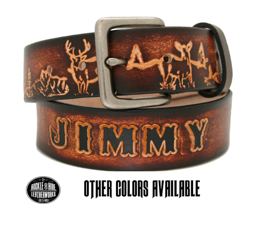 This belt is for the Outdoorsy type with Deer scene embossed onto a solid strip of Veg Tan cowhide, is hand stained brown, with smooth, finished edges. Embossed with a classic deer scene down length of belt, or have name added to scene up to 10 letters. Belt thickness is approx. 1/8", and 1 1/2" wide. Attached with 2 snaps, for easy buckle change, is an antique silver colored buckle. Made just outside Nashville in our Smyrna TN shop.