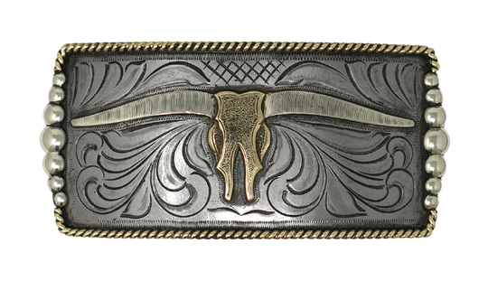 One of our more unique buckles, it has a rectangle shape with a Western scroll design, and a beaded rope edge framing a Longhorn steer. This buckle is made from German Silver (nickel and brass alloy) or iron metal base. Some buckles have motifs made of copper, iron or brass and some are adorned with synthetic stones. Buckle size is Width 5” Height 2” and is available in our Smyrna, TN shop.