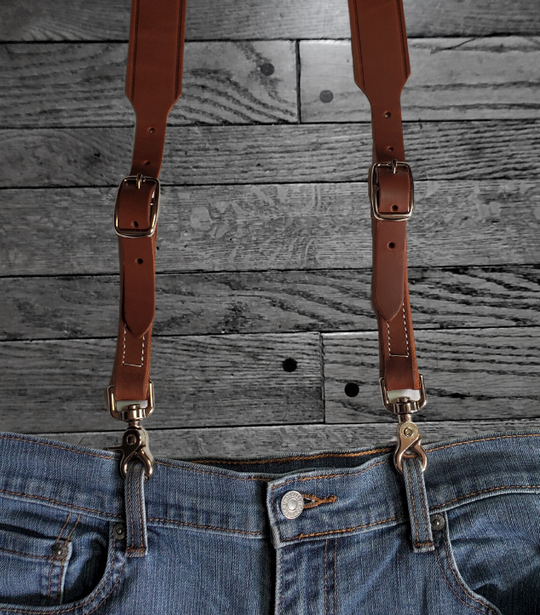 Our USA-made by 3D. Leather suspenders are the perfectly stylish accessory for your wardrobe. The main leather straps are 1 3/8" and taper to 3/4". Buckle adjustment and elastic back and scissor style clips for easy attachment to pants. Stocked in our Smyrna, TN store 20 miles from Nashville. 