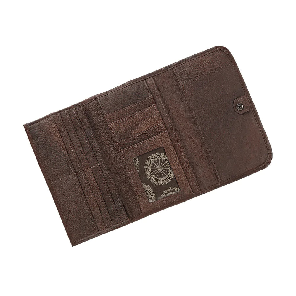 Full grain leather tri-fold wallet hand-stained, boasting a wild western floral hand-tooled pattern. Snappily close it with the spring snap and store your coins in the back zippered pocket. Inside the wallet, you'll find 12 credit card slots, an ID spot, multiple currency stations, and a checkbook flap! Plus, with the cotton linen dividing the pockets, it stays lightweight. Collect yours from our Smyrna, TN spot near Nashville!