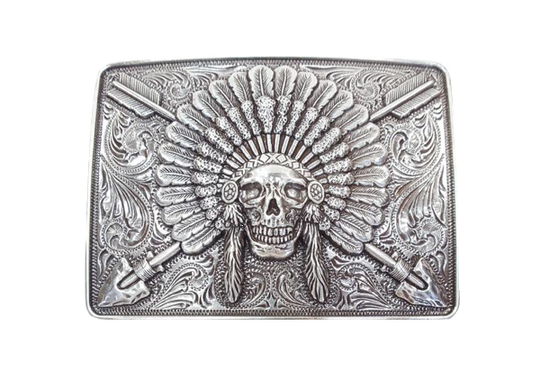 Ariat Indian Chief belt buckle Rectangle shaped buckle with a stylish smooth edge. It features a centered Indian chief skull with headdress and crossing arrows motif surrounded by western scroll engraving. Antiqued Chrome color. Measures 3-1/2" wide x 2-1/2" tall Fits belts up to 1 1/2" wide Available online or in our shop in Smyrna, TN just outside Nashville.