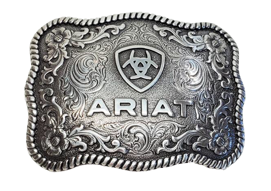 This rectangular shaped buckle has rounded edges and Ariat logo centered on surface. Surface also has scroll and flower designs and rope design around the border of the buckle. Color is antique chrome. Measures 2 1/2" tall by 3 1/2" wide.  Fits belts up to 1 1/2" wide. Available for purchase in our online store or the retail shop in Smyrna, TN, just outside Nashville. Made in Taiwan.