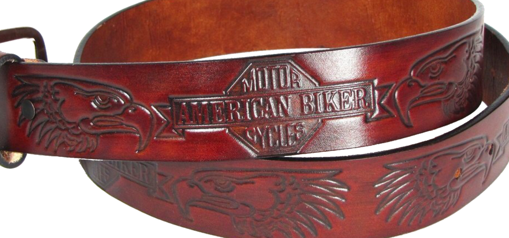 This USA made veg-tan leather belt is approx. 1/8" thick, 1 1/2"width with no fillers to split or rip apart. The belt features American Biker and Eagle heads embossed around the entire belt. The leather is comfortable from day one.  Buckle is silver colored and snapped on for easy buckle change. We don't make this belt but it's Buckle and Hide approved and still made in the USA