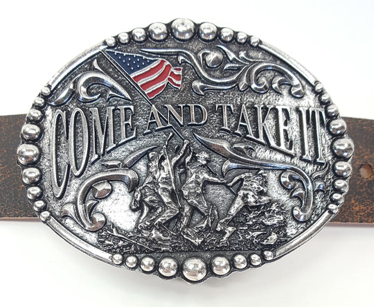 Come and Take It motif buckle by AndWest has Come and Take It wording and pictures soldiers raising and American Flag. Decorative scrolling and designs around edges. Dimensions are 3 2/4" tall by 4 1/4" wide Made in Mexico Available in our online shop as well as in the retail shop in Smyrna, TN, just outside Nashville. Pictured on belt.