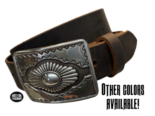 "The Cody" is a Western style belt buckle that will add a classic western look to your belt. ﻿CHOOSE ONE BELT STRIP COLOR! ﻿The belt is made from a single strip of leather in our shop in Smyrna, TN, just outside Nashville. The buckle is imported. ﻿Available in our retail and online shops. Main photo.