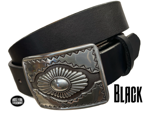 "The Cody" is a Western style belt buckle that will add a classic western look to your belt. ﻿CHOOSE ONE BELT STRIP COLOR! ﻿The belt is made from a single strip of leather in our shop in Smyrna, TN, just outside Nashville. The buckle is imported. ﻿Available in our retail and online shops. Black.