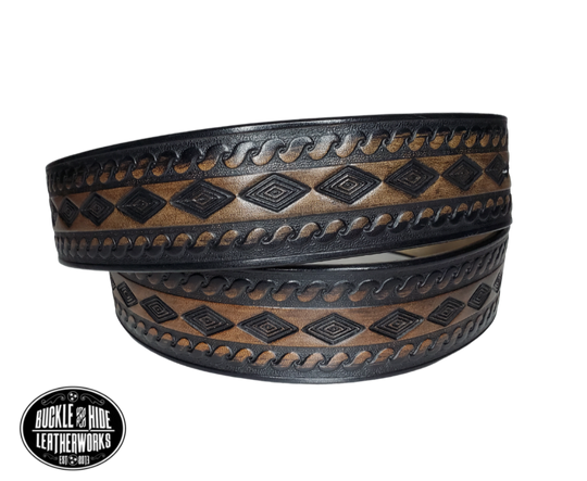 "The Banjo" is a handmade real leather belt made from a single strip of cowhide shoulder leather that is 8-10 oz. or approx. 1/8" thick. It has hand burnished (smoothed) edges and a Diamond center with a rope edge pattern. This belt is completely HAND dyed with a multi step finishing technic. The antique nickel plated solid brass buckle is snapped in place with heavy snaps.  This belt is made just outside Nashville in Smyrna, TN.