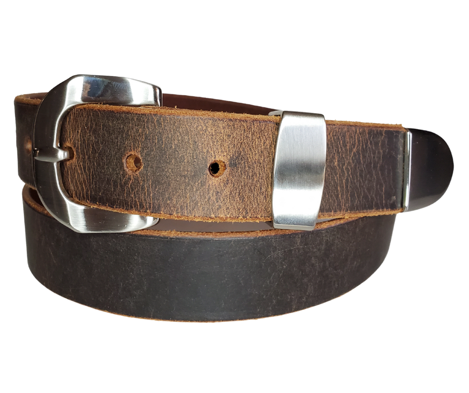 "The Arrington" handmade all leather belt is made from a single strip of Veg-Tan Distressed Water Buffalo that is 8-10 oz., or approx. 1/8" thick.  It has a 3 piece Antique Nickle plated over brass buckle with unique NO PIN for the adjustment hole that is never out of style!  The buckle is snapped in place if you ever want to change. This 1 1/4" belt is made just outside Nashville in Smyrna, TN. Perfect for casual and dress wear, it can be for personal use or for groomsman gifts or other gifts as well. 