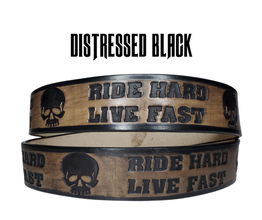 "The Daytona" is a handmade real leather belt made from a single strip of cowhide shoulder leather that is 8-10 oz. or approx. 1/8" thick. It has hand burnished (smoothed) edges and features the mantra "RIDE HARD LIVE FAST" and an HD Skull pattern down the center. This belt is completely HAND dyed with a multi step finishing technic. The antique nickel plated solid brass buckle is snapped in place with heavy snaps.  This belt is made just outside Nashville in Smyrna, TN.