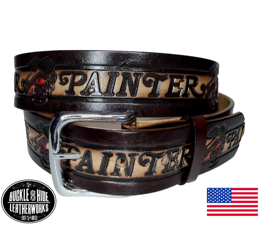 This belt is made using machines to speed up the process but still Buckle and Hide approved. This USA made veg-tan leather belt is approx. 1/8" thick, 1 1/2"width with no fillers to split or rip apart. The belt features Paintbrushes and paint cans scattered around the entire belt.  Buckle is snapped on for easy buckle change. Colors may vary due to the manufacturing process.  Available online and in our shop in Smyrna, TN