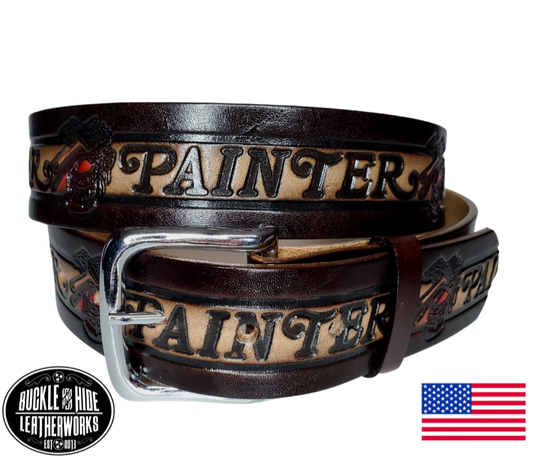 This belt is made using machines to speed up the process but still Buckle and Hide approved. This USA made veg-tan leather belt is approx. 1/8" thick, 1 1/2"width with no fillers to split or rip apart. The belt features Paintbrushes and paint cans scattered around the entire belt.  Buckle is snapped on for easy buckle change. Colors may vary due to the manufacturing process.  Available online and in our shop in Smyrna, TN