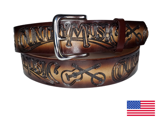 This USA made veg-tan leather belt is approx. 1/8" thick, 1 1/2"width with no fillers to split or rip apart. The belt features Guitar, Banjos with COUNTRY MUSIC embossed around the entire belt. The color has a Dark Brown edge faded into a Natural colored center. The leather is comfortable from day one   Buckle is snapped on for easy buckle change. Colors may vary do to the manufacturing process. We don't make this belt but it's Buckle and Hide approved and still made in the USA. 