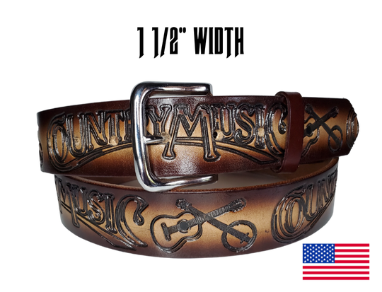 This USA made veg-tan leather belt is approx. 1/8" thick, 1 1/2"width with no fillers to split or rip apart. The belt features Guitar, Banjos with COUNTRY MUSIC embossed around the entire belt. The color has a Dark Brown edge faded into a Natural colored center. The leather is comfortable from day one   Buckle is snapped on for easy buckle change. Colors may vary do to the manufacturing process. We don't make this belt but it's Buckle and Hide approved and still made in the USA. 