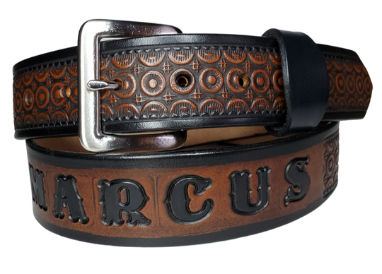 "The Bullock" is a handmade real leather belt made from a single strip of cowhide shoulder leather that is 8-10 oz. or approx. 1/8" thick. It has hand burnished (smoothed) edges and a Western Circle pattern. This belt is completely HAND dyed with a multi step finishing technic. The antique nickel plated solid brass buckle is snapped in place with heavy snaps.  This belt is made just outside Nashville in Smyrna, TN.