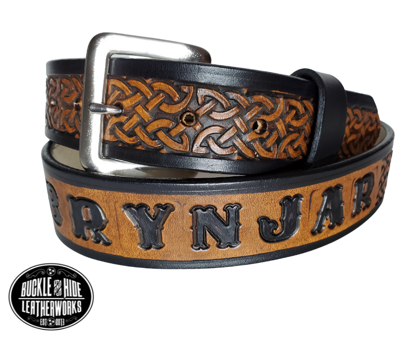 "The Magnus" is a handmade real leather belt made from a single strip of cowhide shoulder leather that is 8-10 oz. or approx. 1/8" thick. It has hand burnished (smoothed) edges and the Classic knotted Celtic pattern. This belt is completely HAND dyed with a multi step finishing technic. The antique nickel plated solid brass buckle is snapped in place with heavy snaps.  This belt is made just outside Nashville in Smyrna, TN.