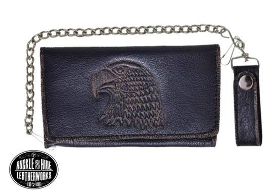 It's Cowhide LEATHER with a Eagle Head embossed that's slightly distressed brown! Popular Long Style Tri-fold Chain Wallet.  Nylon lined 6 card slots in the middle with a I.D. slot, 1 nylon lined zippered pocket, 3 underneath cash slots, for all your important stash. It's imported but it's Buckle and Hide approved. Complete with a 18" chrome plated chain (including leather belt loop. Standard long tri-fold size. Size is 7" x 3 1/2" when snapped closed.