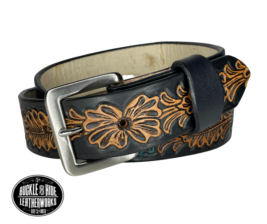 "The Desperado" is a handmade real leather belt made from a single strip of cowhide shoulder leather that is 8-10 oz. or approx. 1/8" thick. It has hand burnished (smoothed) edges and the Classic Western pattern. This belt is completely HAND dyed with a multi step finishing/painting technic. The antique nickel plated solid brass buckle is snapped in place with heavy snaps.  This belt is made just outside Nashville in Smyrna, TN.