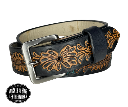 "The Desperado" is a handmade real leather belt made from a single strip of cowhide shoulder leather that is 8-10 oz. or approx. 1/8" thick. It has hand burnished (smoothed) edges and the Classic Western pattern. This belt is completely HAND dyed with a multi step finishing/painting technic. The antique nickel plated solid brass buckle is snapped in place with heavy snaps.  This belt is made just outside Nashville in Smyrna, TN.