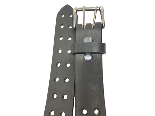 Our handmade Extra Heavy double hole leather belt is made from 12-14 oz. (approx 1/4" thick) bridle cowhide leather that is drum dyed all the way through. The double holes run the length of the belt. Buckle is a heavy double pronged roller buckle with antique nickel plated finish that is snapped in place on the end.  The width is 1 3/4", edges are smoothed and painted.  Made just outside Nashville in Smyrna, TN.  Available in black or brown.