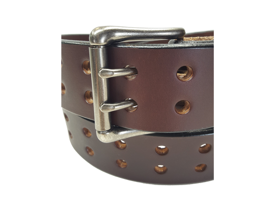 Our handmade Extra Heavy double hole leather belt is made from 12-14 oz. (approx 1/4" thick) bridle cowhide leather that is drum dyed all the way through. The double holes run the length of the belt. Buckle is a heavy double pronged roller buckle with antique nickel plated finish that is snapped in place on the end.  The width is 1 3/4", edges are smoothed and painted.  Made just outside Nashville in Smyrna, TN.  Available in black or brown.