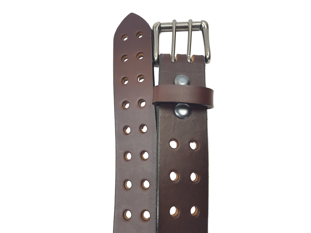 Our handmade Extra Heavy double hole leather belt is made from 12-14 oz. (approx 1/4" thick) bridle cowhide leather that is drum dyed all the way through. The double holes run the length of the belt. Buckle is a heavy double pronged roller buckle with antique nickel plated finish that is snapped in place on the end.  The width is 1 3/4", edges are smoothed and painted.  Made just outside Nashville in Smyrna, TN.  Available in black or brown.