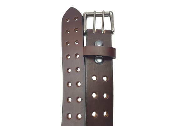 Our handmade Extra Heavy double hole leather belt is made from 12-14 oz. (approx 1/4" thick) bridle cowhide leather that is drum dyed all the way through. The double holes run the length of the belt. Buckle is a heavy double pronged roller buckle with antique nickel plated finish that is snapped in place on the end.  The width is 1 3/4", edges are smoothed and painted.  Made just outside Nashville in Smyrna, TN.  Available in black or brown.