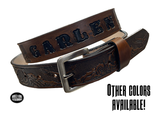 This Eagle Mesa Name Leather Belt offers a unique homage to the American Wild West. Crafted from top-quality Veg tan cowhide and featuring a detailed Eagle-over-desert embossing, this belt is a stylish and practical choice. It's even customizable with name and multiple finish options. Handmade near Nashville in Smyrna TN.