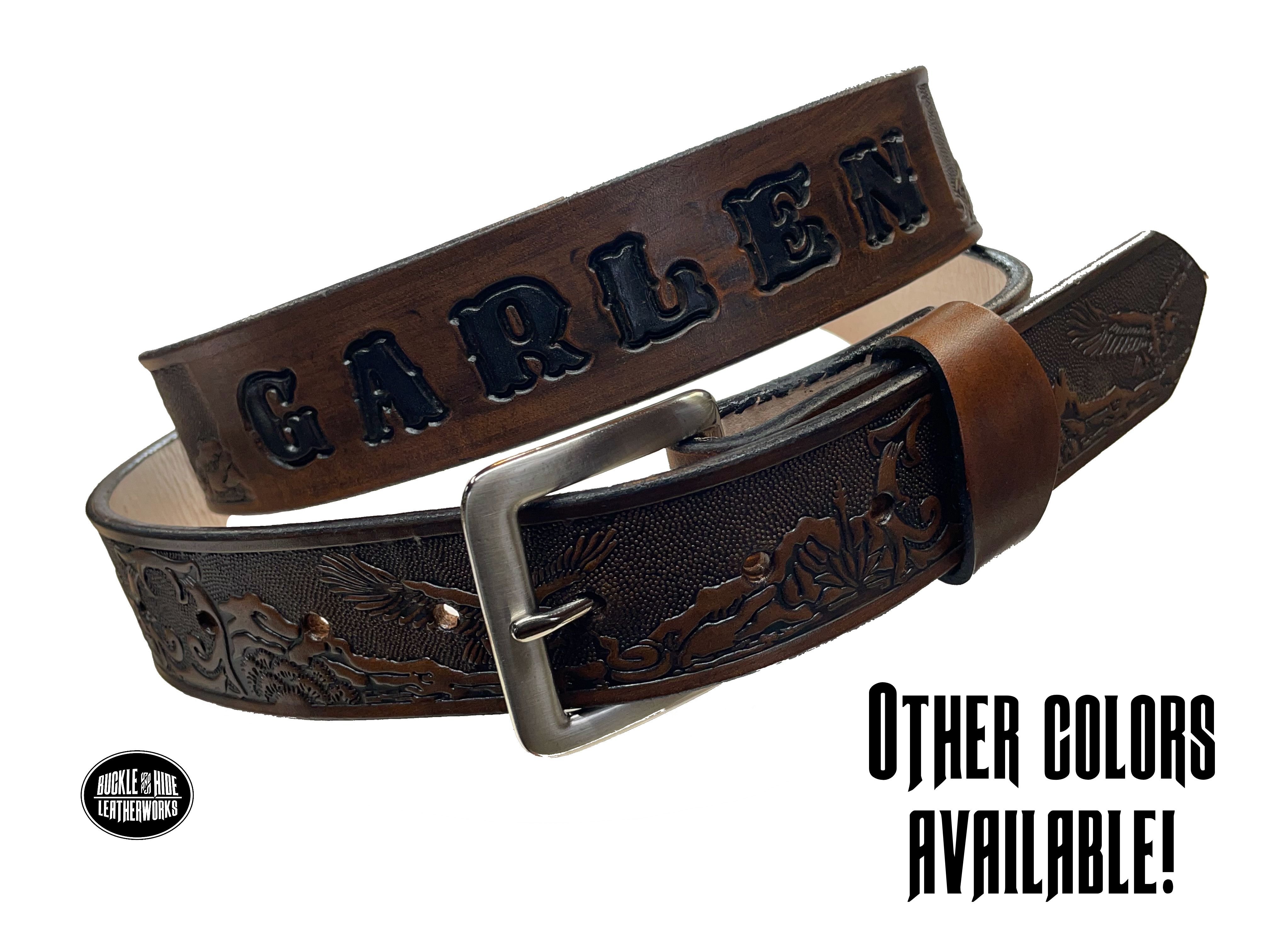 This Eagle Mesa Name Leather Belt offers a unique homage to the American Wild West. Crafted from top-quality Veg tan cowhide and featuring a detailed Eagle-over-desert embossing, this belt is a stylish and practical choice. It's even customizable with name and multiple finish options. Handmade near Nashville in Smyrna TN.