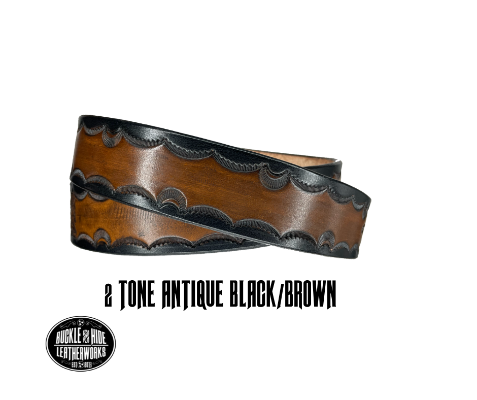 The Galinburg handmade all leather belt is made from a single strip of Veg-Tan cowhide or drum dyed (colored all the way through) Black cowhide shoulder leather.  The Black/Choc brown is a hand finished Veg-tan that is 9-10 oz., or approx. 1/8" thick.  The width is 1 1/2".    The antique nickel plated solid brass buckle is snapped in place. This belt is made just outside Nashville in Smyrna, TN. Perfect for casual and dress wear, it can be for personal use or for groomsman gifts or other gifts as 