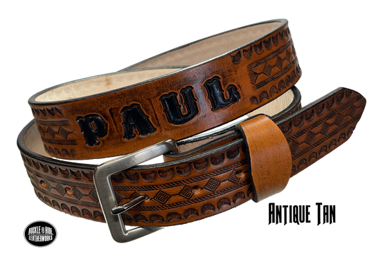 Full grain American vegetable tanned cowhide approx. 1/8"thick. Width 1 1/2" and includes Antique Nickle plated Solid Brass buckle Hand Finished in 3 color options Smooth burnished painted edges Choose with or without name, if without name, design will cover entire length of belt For name Type name desired on belt in "Type Name Here" section, no more than 8 letters maximum Buckle snaps in place for easy changing if desired Made in our Smyrna, TN, USA shop