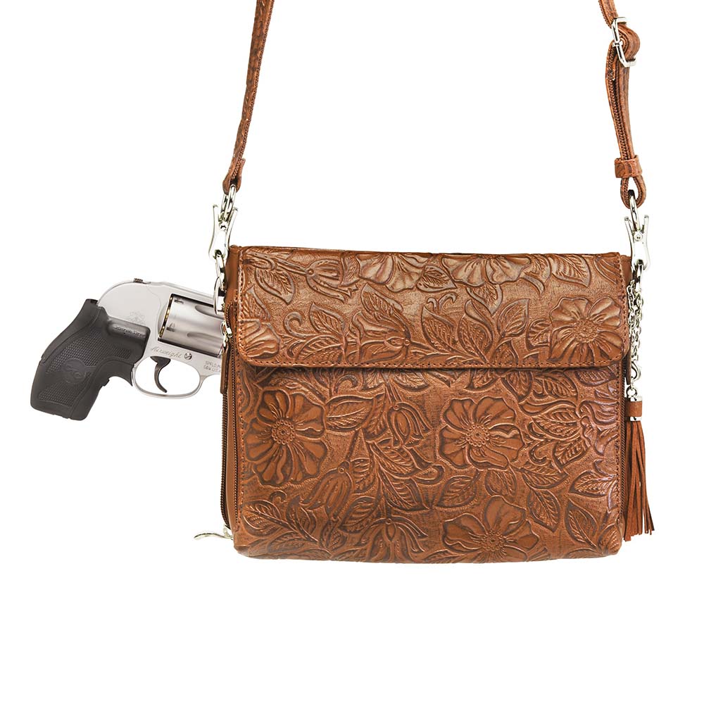 Tooled American Cowhide Clutch W/Carry Conceal Compartment. Designed for either Left or Right handed use, CCW special outside back compartment zips open on 3 sides, Special padding to prevent imprinting, Adjust holster to your comfort draw angle, Choose Black, Tan or Cherry. These are typically in-stock in our retail store in Smyrna, TN. not far from Nashville. Call for current stock.