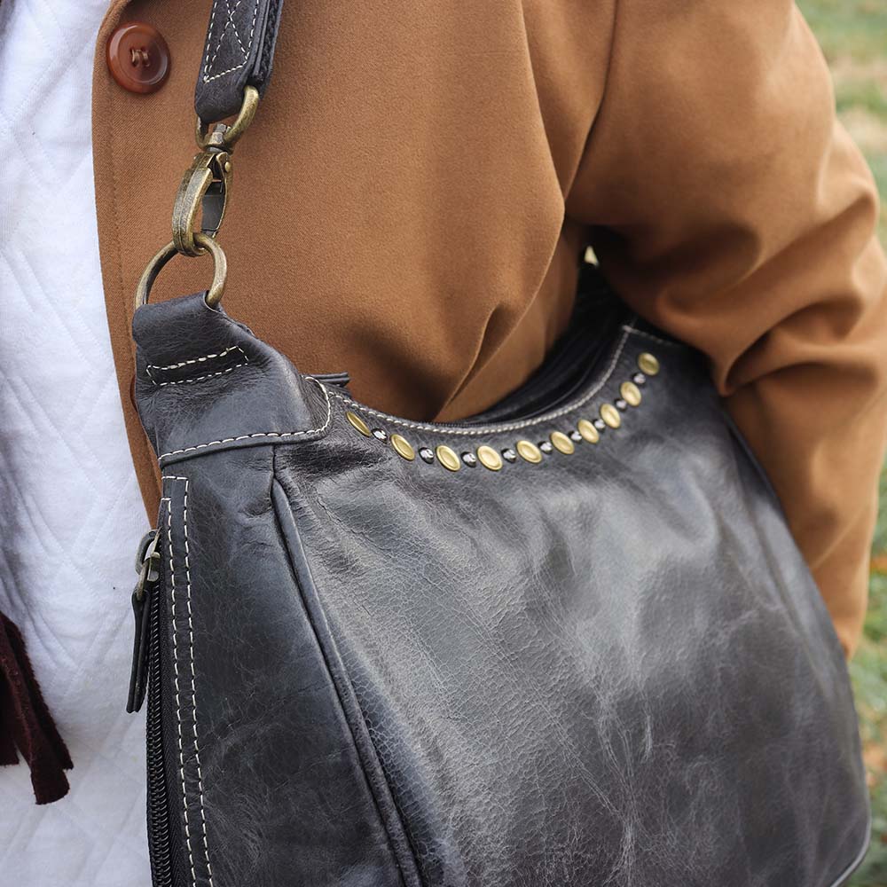 Carry Conceal Leather RFID Hobo Purse. Distressed Vintage Tanned Full Grain Buffalo Leather. Rich distressed patina comes with use &amp; age, Wonderfully soft from oils infused in tanning process Easily handles tuff daily use! Get yours at our Smyrna, TN store not far from Murfreesboro, Tn.