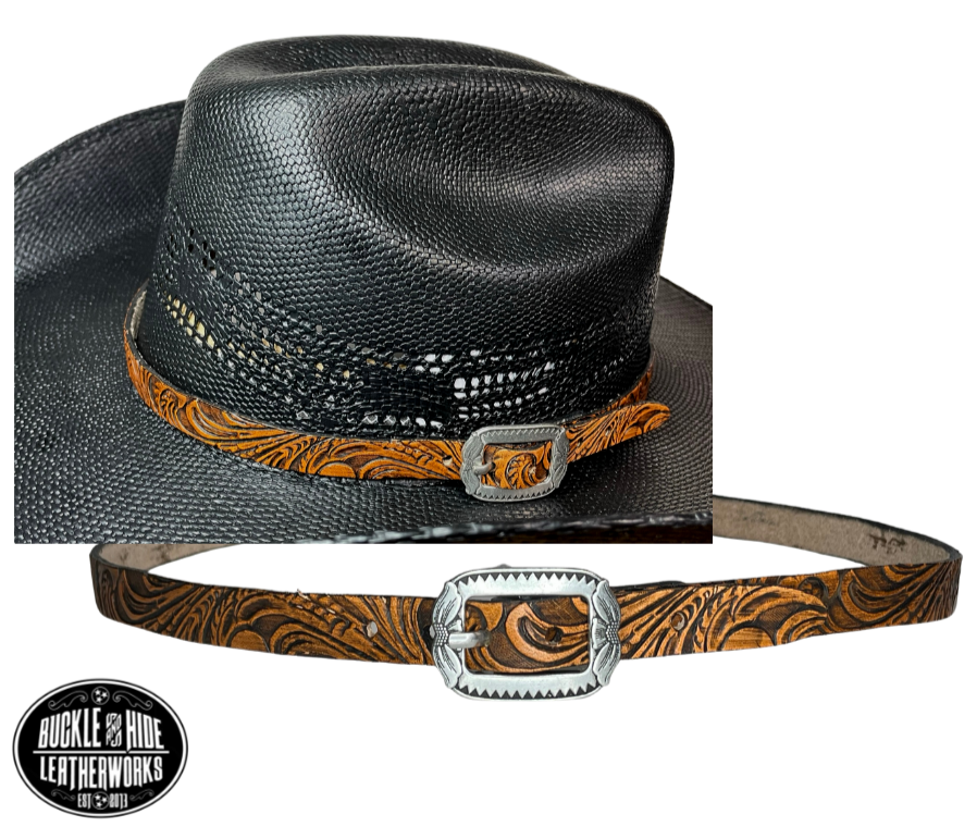 A classic Western tooled pattern with a Western styled Antique nickel center bar buckle completes our Embossed Hand stained leather hatband. Band is 1/2" wide will fit up to size 7 1/2 hat. Matches our Rustler Belt. Fit's most any hat with adjustable bead and leather 1/8" string. Will fit most WESTERN crowned hats. Made in our Smyrna Tn. shop.   