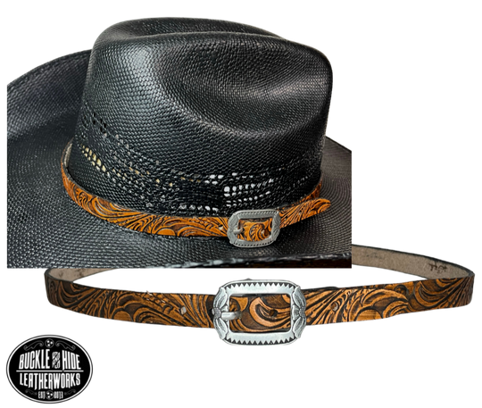 A classic Western tooled pattern with a Western styled Antique nickel center bar buckle completes our Embossed Hand stained leather hatband. Band is 1/2" wide will fit up to size 7 1/2 hat. Matches our Rustler Belt. Fit's most any hat with adjustable bead and leather 1/8" string. Will fit most WESTERN crowned hats. Made in our Smyrna Tn. shop.   