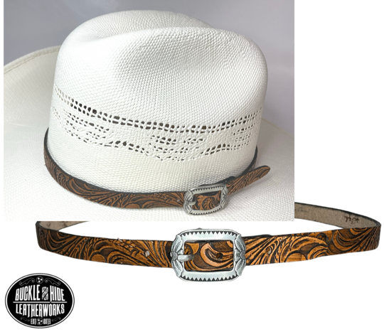 A classic Western tooled pattern with a Western styled Antique nickel center bar buckle completes our Embossed Hand stained leather hatband. Band is 1/2" wide will fit up to size 7 1/2 hat. Matches our Rustler Belt. Fit's most any hat with adjustable bead and leather 1/8" string. Will fit most WESTERN crowned hats. Made in our Smyrna Tn. shop.   