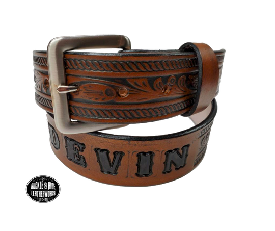 Be the star of the show with our "High Noon" Western Name Veg tan Leather Belt! Made with Veg tan cowhide in our Smyrna TN  shop just 20 miles outside of Nashville. It's designed for comfort and durability. Add a personalized name and change the buckle any time, all in 1 1/2" width of classic western style! Saddle up and get yours today!