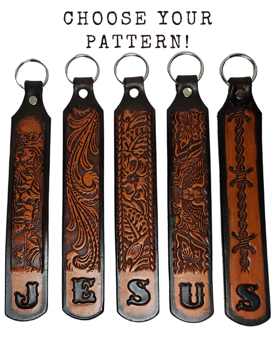 Our Customizable "1975" Longer Leather keychain embossed similar to our popular belts.  Great for identifying luggage, backpacks, or your keys! Available in the below choices All colored in our popular 2 TONE BROWN, pick one or a few. Made in our Smyrna, TN shop. Please type desired name in CUSTOM box.   Measures...approx. 1" x 7"