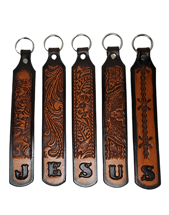 Our Customizable "1975" Longer Leather keychain embossed similar to our popular belts. Great for identifying luggage, backpacks, or your keys! Available in the below choices All colored in our popular 2 TONE BROWN, pick one or a few. Made in our Smyrna, TN shop. Please type desired name in CUSTOM box. Measures...approx. 1" x 7"