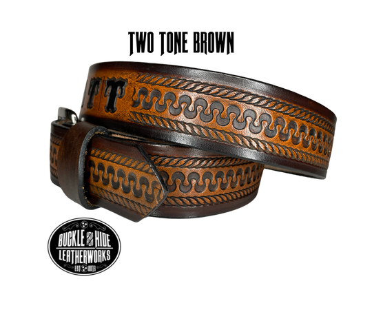 This belt's got some class! Embossed with a classic western serpentine/rope pattern and made with 1/8" thick Veg tan cowhide, the "Law Dawg" Name Leather Belt will give you the durability and style to last for miles and miles if you get a bit rowdy - It's made in our Smyrna, TN shop just outside Nashville, TN. Saddle up!