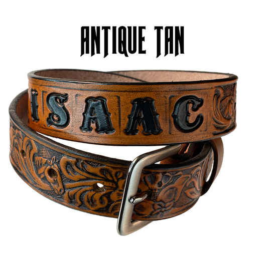 Introduce your little one to the iconic style of the west with the "Lil' Mustang" Leather KIDS/CHILDRENS Name Belt! Durable veg tan leather ensures that your cowboy or cowgirl can look good while feeling comfortable, and a unique western floral design featuring horses adds a touch of fun. A 1 1/4" width with snaps makes swapping out buckles a snap! Proudly made in Smyrna TN, just outside Nashville. 