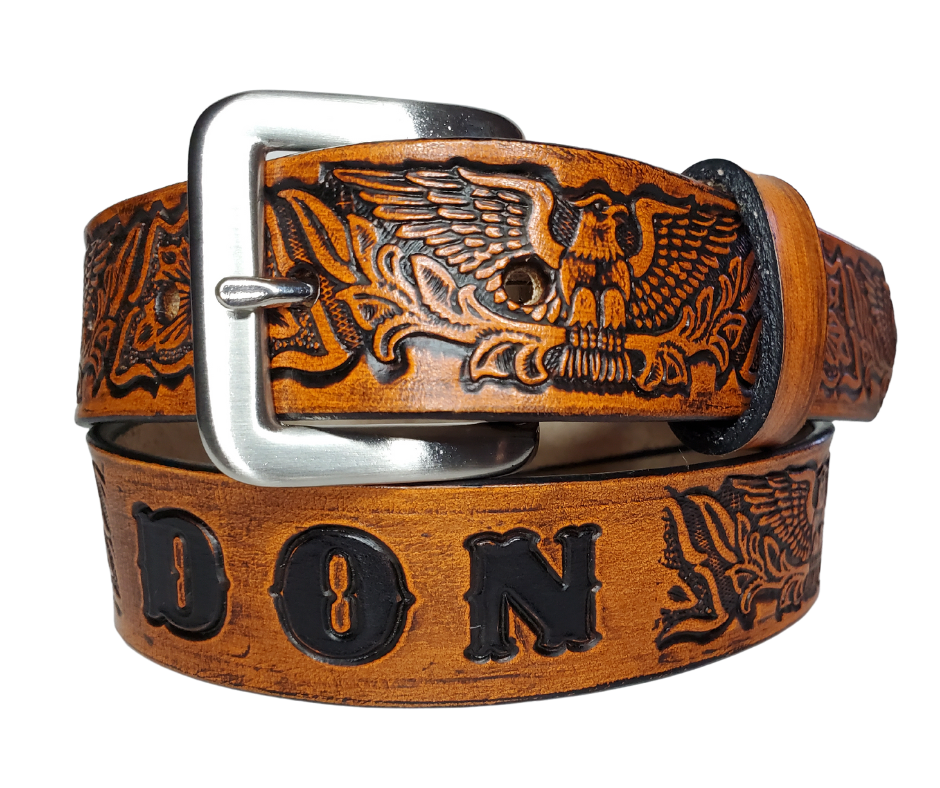 Our "Patriot" is just like the Patriot' for dad or mom. Full grain American vegetable tanned cowhide approx. 1/8"thick. Width is 1 1/4" and includes Antique Nickle plated Solid Brass buckle. We Hand Finish with each belt. Edges are smooth burnished painted edges. Made in our Smyrna, TN, USA shop. Buckle snaps in place for easy changing if desired.  Choose with or without name, if without name 