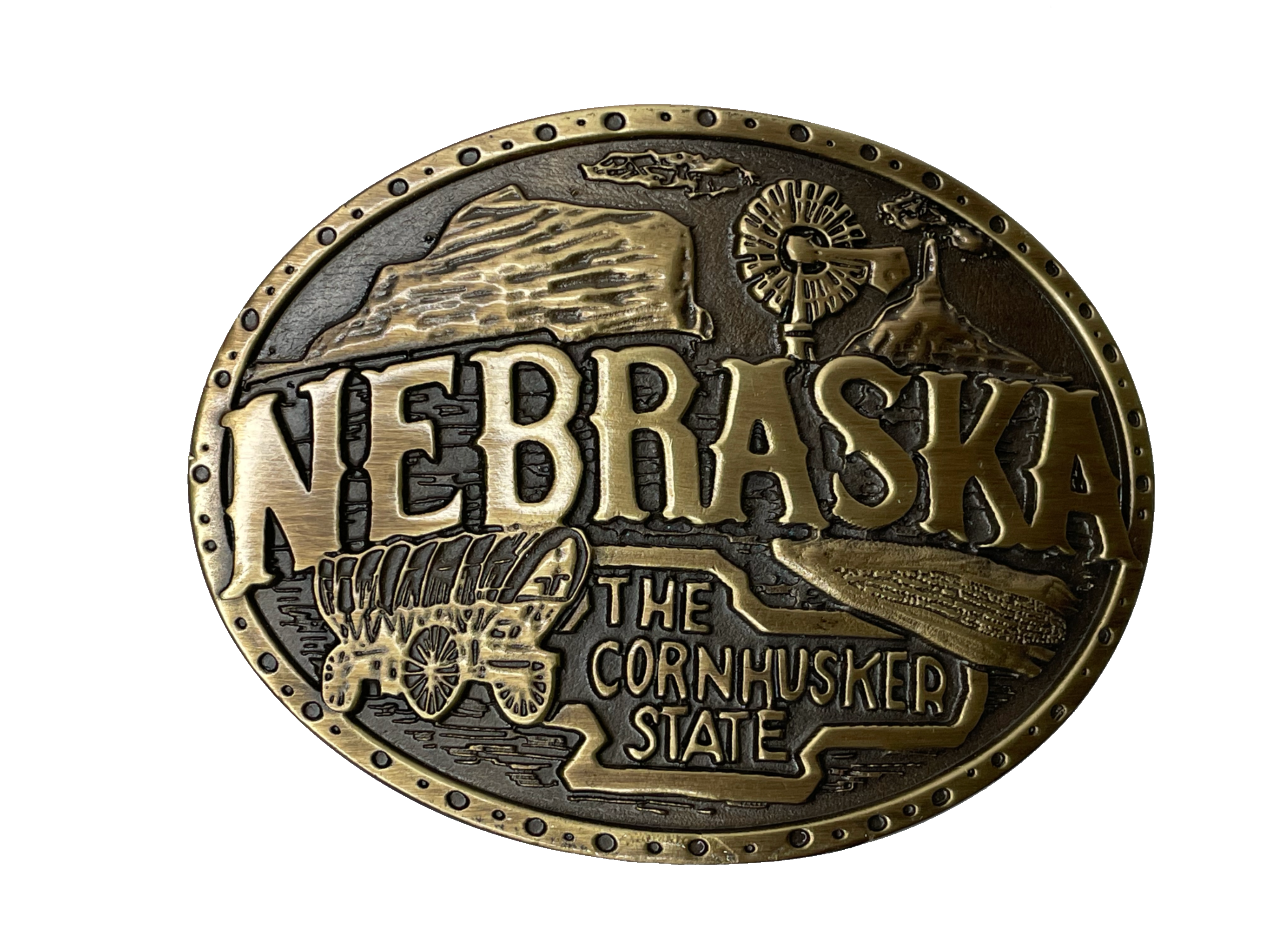 Nebraska State buckle by AndWest Dimensions are 3" tall by 3 3/4" wide Fits belts up to 1 1/2" wide Buckle is brass colored with Nebraska Cornhusker State embossed across front of buckle. Farming scene in the back behind "Nebraska". Back of buckle has Western scroll design Available in our online store and in the retail shop in Smyrna, TN, just outside of Nashville. Made in Mexico