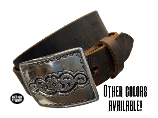 Rectangular antique silver belt buckle with western style tooling, size approx. 3" wide by 2 1/2" tall. Belt is handmade from a single strip of leather in our shop. Belt colors available are distressed brown, black, and dark brown. Buckle snaps in place for easy changing if desired.﻿ CHOOSE ONE BELT STRIP COLOR! Available online and at our shop just outside Nashville in Smyrna, TN. Main photo.