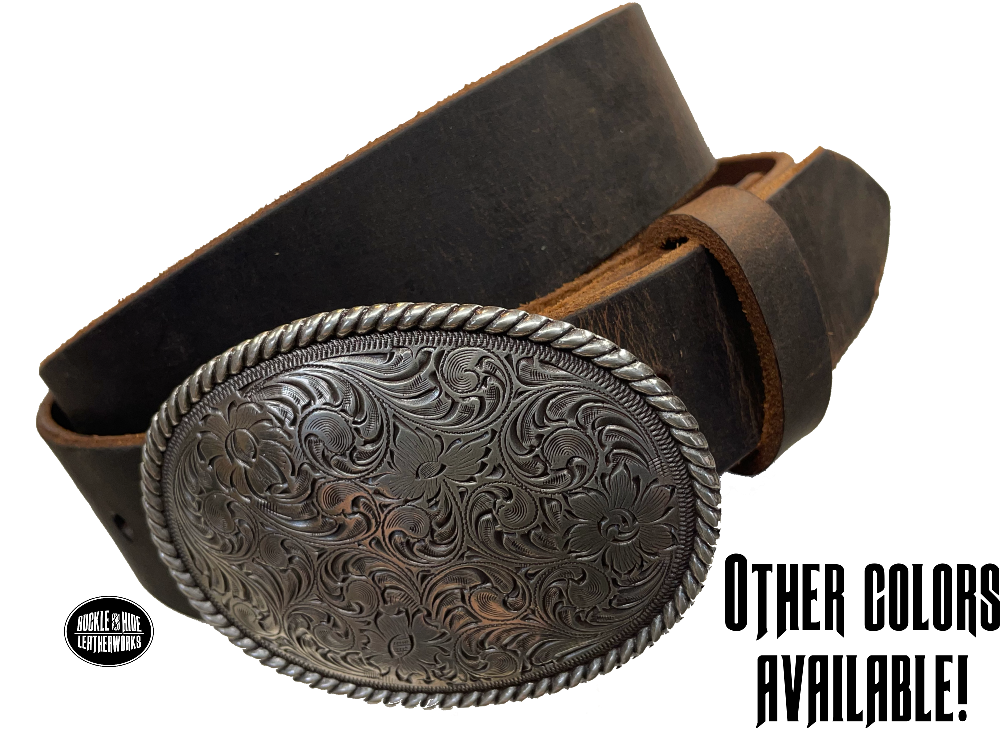 This oval shaped buckle by Nocona has a rope design around the border. It is chrome colored with scroll design etched appearance on surface.  Measures 2 3/4" tall by 3 3/4" wide and fits belts up to 1 1/2" wide. Buckle is made in Taiwan. Belt is a solid strip of leather and made in our shop in Smyrna, TN, just outside Nashville. It is 1 1/2" wide and available in sizes 34"-44" and colors distressed brown, black, and dark brown. ﻿It is available for purchase in our retail shop and online store. Main photo.