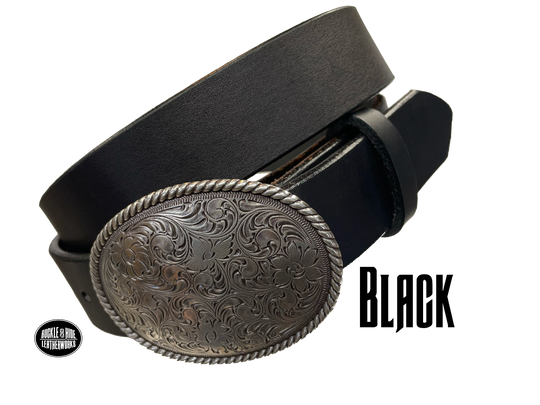 This oval shaped buckle by Nocona has a rope design around the border. It is chrome colored with scroll design etched appearance on surface.  Measures 2 3/4" tall by 3 3/4" wide and fits belts up to 1 1/2" wide. Buckle is made in Taiwan. Belt is a solid strip of leather and made in our shop in Smyrna, TN, just outside Nashville. It is 1 1/2" wide and available in sizes 34"-44" and colors distressed brown, black, and dark brown. It is available for purchase in our retail shop and online store. Black.