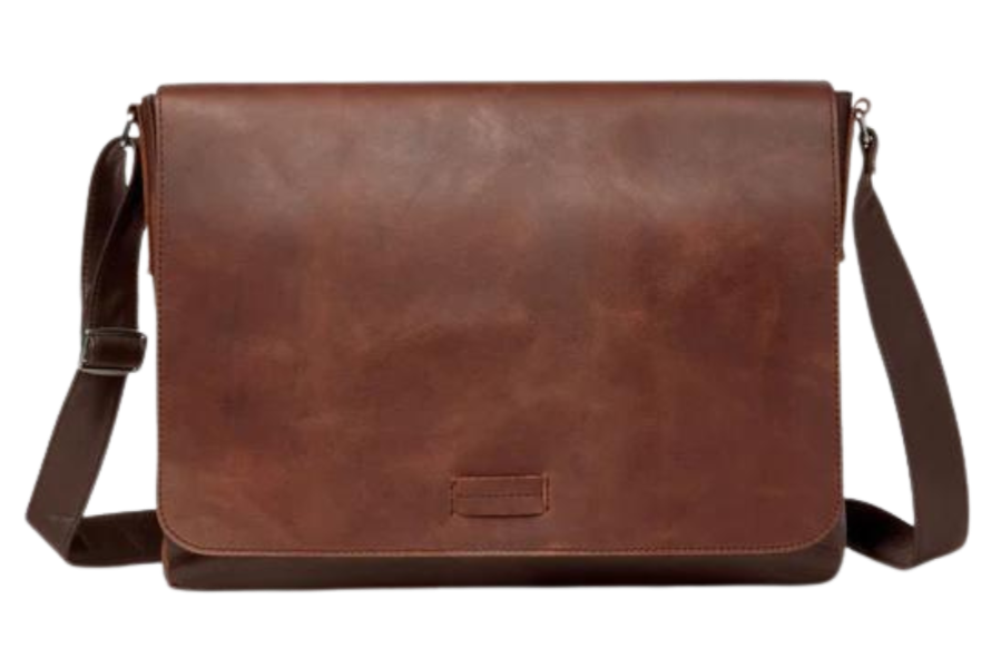 This 2 tone brown leather messenger bag is made from real cowhide leather.&nbsp; Flap is a smooth oil tanned leather with a distressed look and the body has contrasting soft pebbled grain leather. The flap secures with a magnetic snap. Dimensions are approx. 15" by 12" by 3". Back pocket will hold a full size laptop.&nbsp; Inner bag is lined with nylon and leather trim and hardware is brushed nickel. Available for purchase in our retail shop in Smyrna, TN, just outside Nashville.